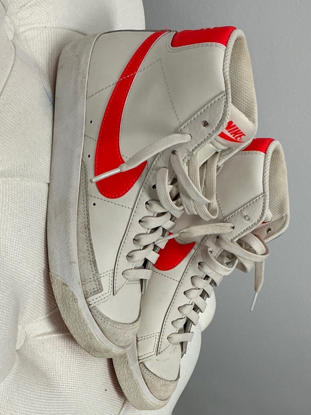 Nike White High-Top Sneakers with Red Swoosh and Heel
